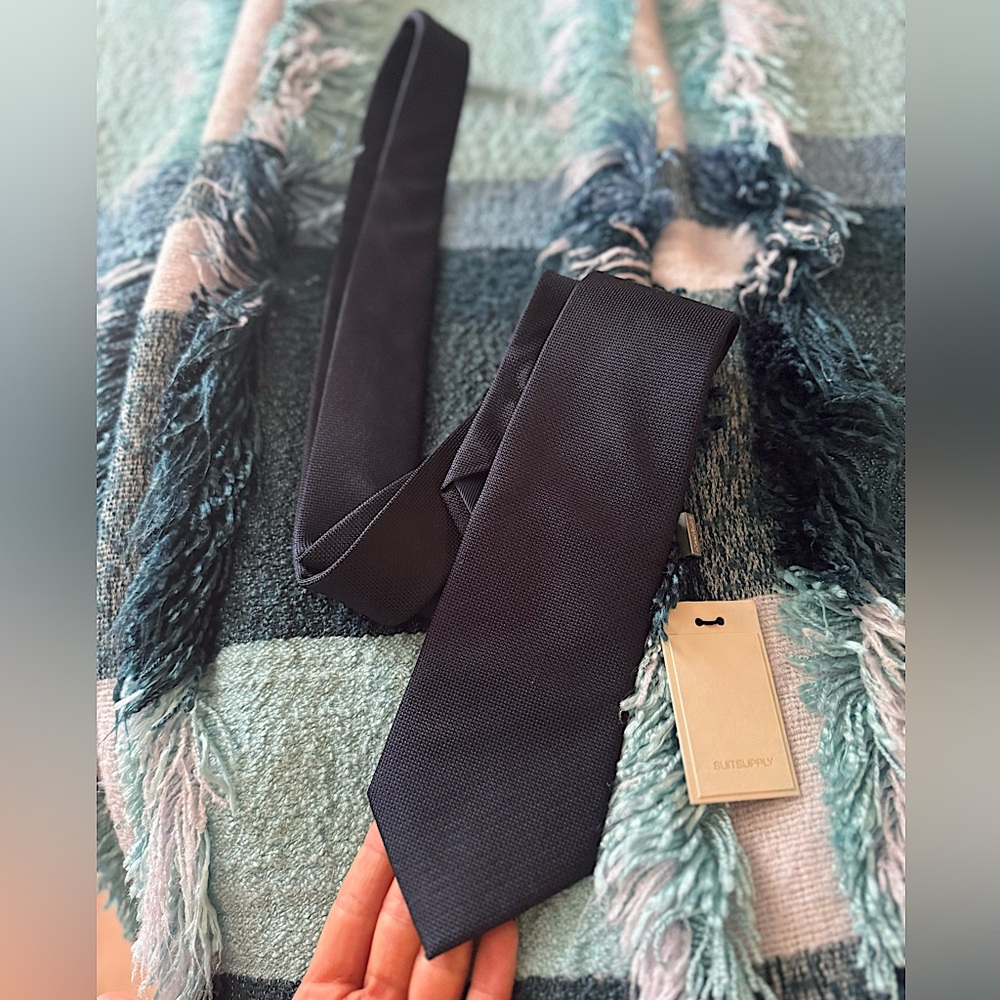 Man’s navy blue tie